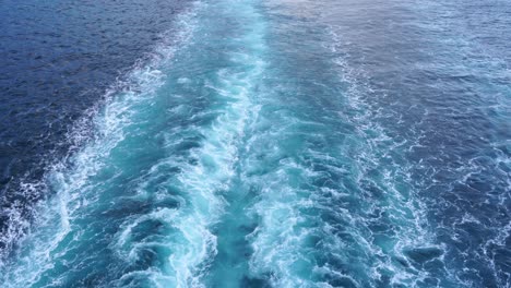 blue stern waves on the ocean, beautiful pattern on the foamy water surface