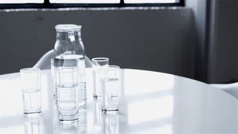 close up of a pitcher and glasses