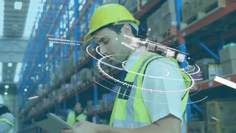 Animation-of-scope-scanning-and-globe-over-man-using-tablet-in-warehouse