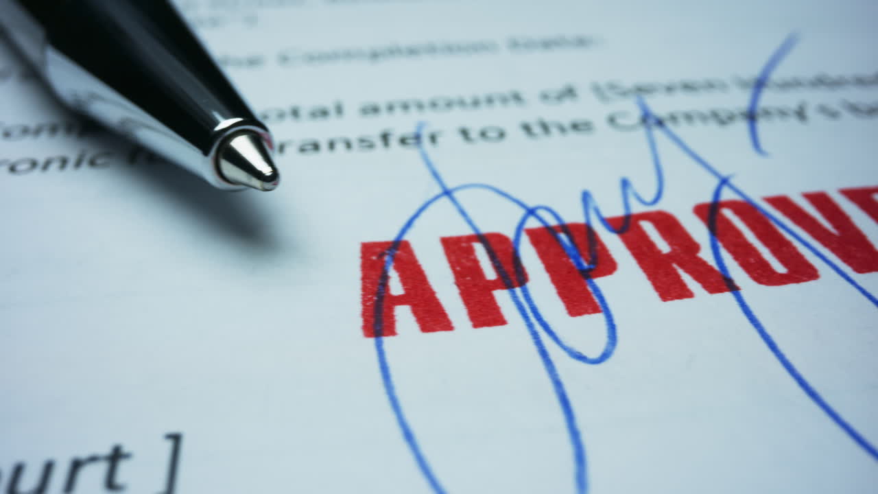 Pen lying on contract. Document with approved stamp. Signature on contract