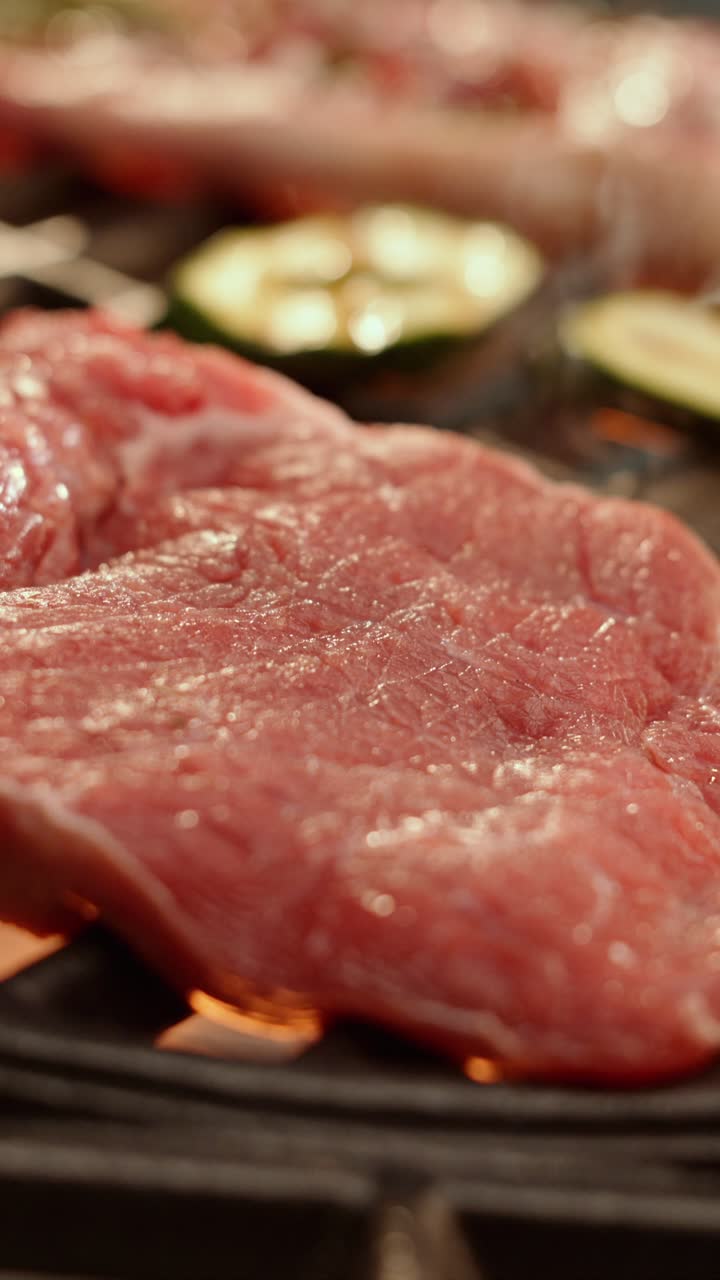 Meat and zucchini on the grill