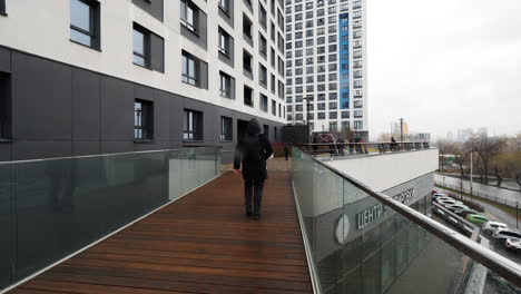 modern apartment building with pedestrian bridge