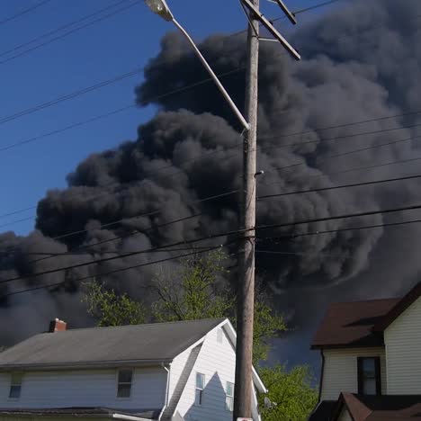 news media covering giant fire and smoke cloud