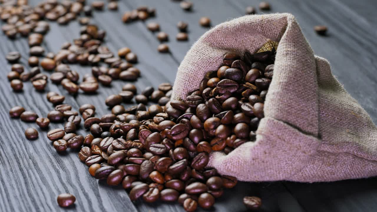 Roasted coffee beans on table. Fresh coffee beans on wooden table