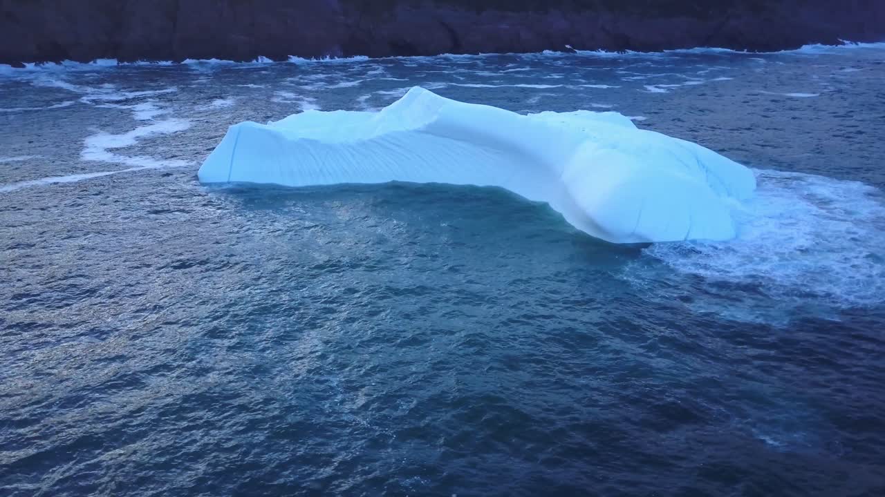 Iceberg floating near the coast