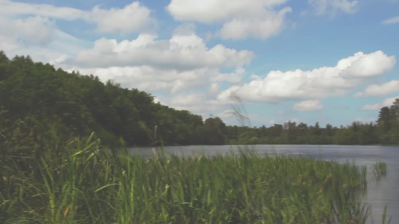 Blue sky over lake - timelapse