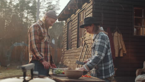 Man-and-Woman-Preparing-Food-for-Cooking-on-Barbecue