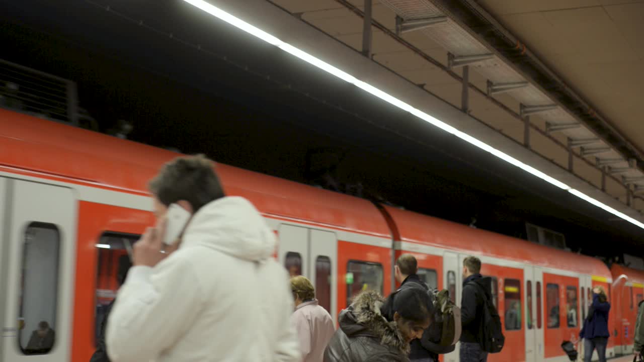 People Boarding a Train at a Train Station