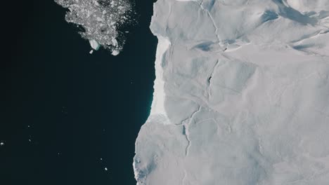 drone over sea and ice of ilulissat icefjord