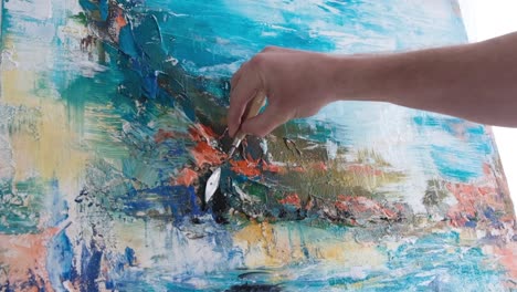 the restoration procedure of the painting. restorer artist restore paint on picture. close-up