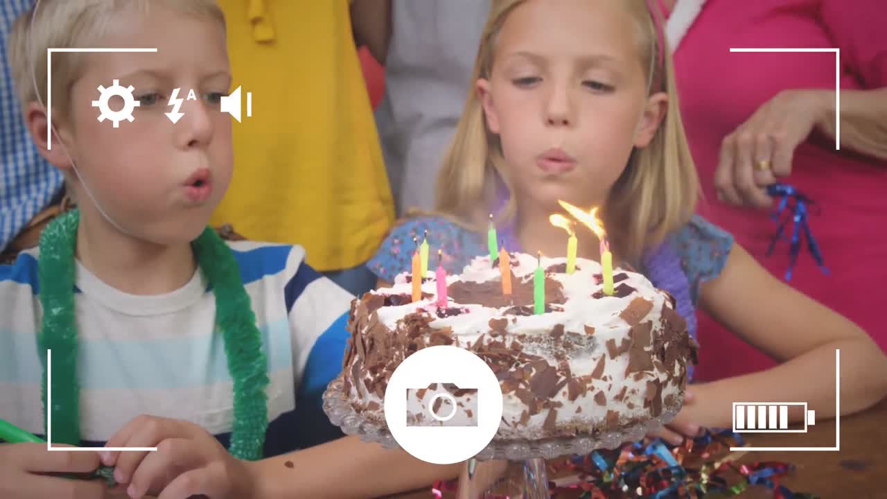 Taking photos of children at birthday party on a digital camera