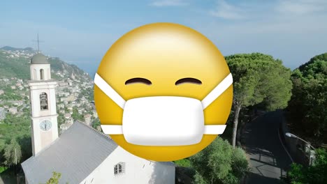Digital-composition-of-face-wearing-mask-emoji-against-aerial-view-of-cityscape