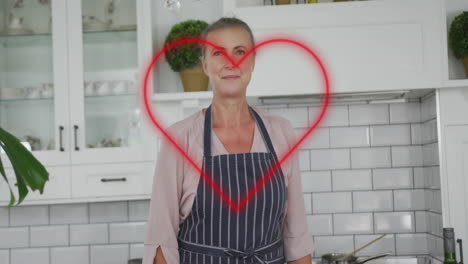 smiling woman in kitchen with heart animation over her face