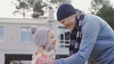 father kissing daughter on forehead 4k