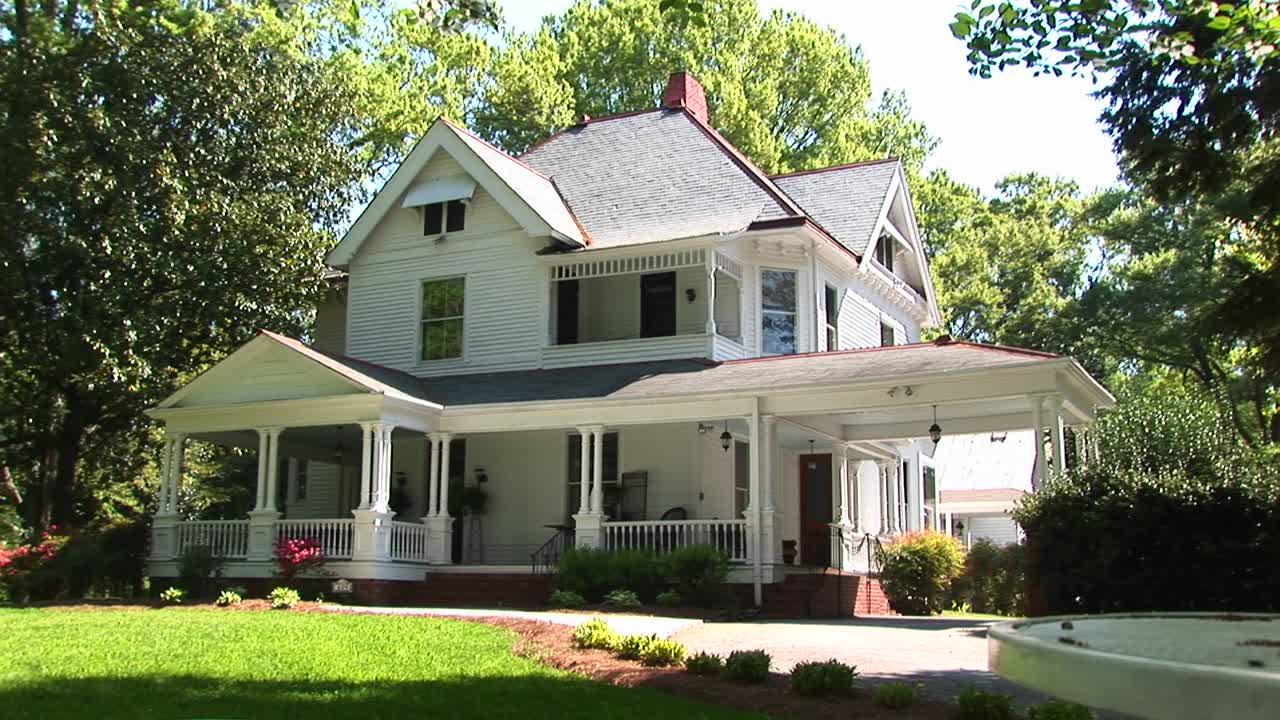 Beautiful Landscaping And Trees Surround This Twostory Country Home
