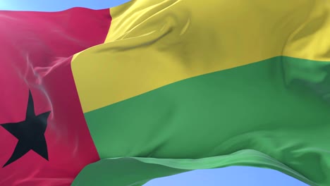 Bissau-Guinean flag waving at wind in slow in blue sky, loop
