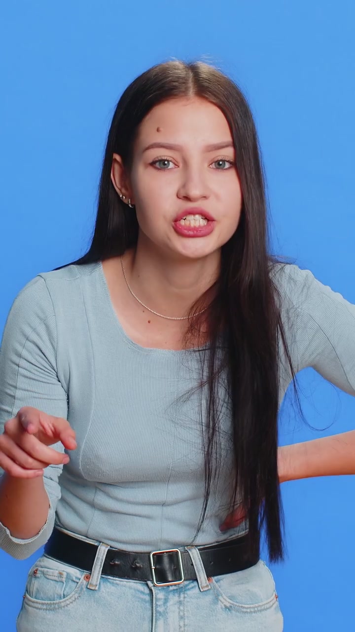 Irritated displeased aggressive unhappy woman gesturing hands blaming scolding for failure problem