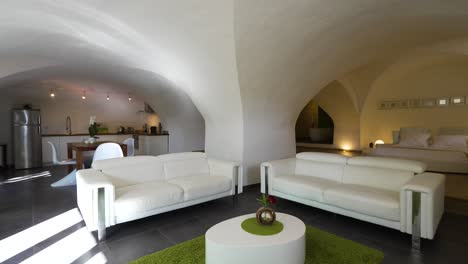 slow orbiting shot of a modern white underground room within a villa in nimes