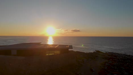 Aerial-drone-view-over-the-Guincho-beach,-tranquil-evening,-in-Lisbon,-Portugal