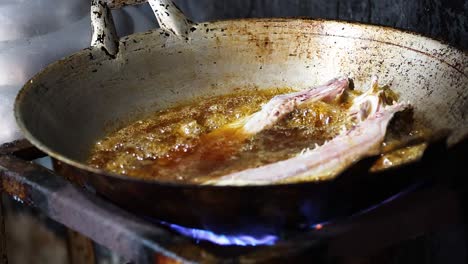 cooking fish fillet in hot frying pan