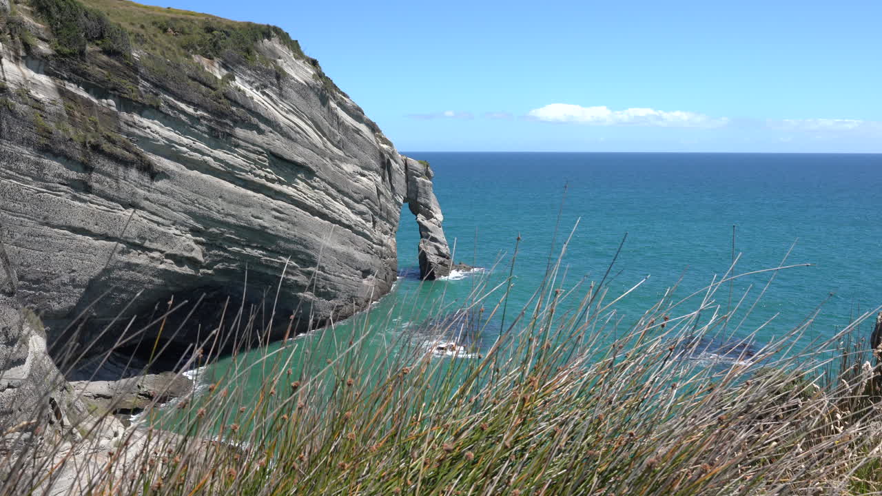 Cape Farewell cliffs and rock formations near Farewell spit in New Zealand