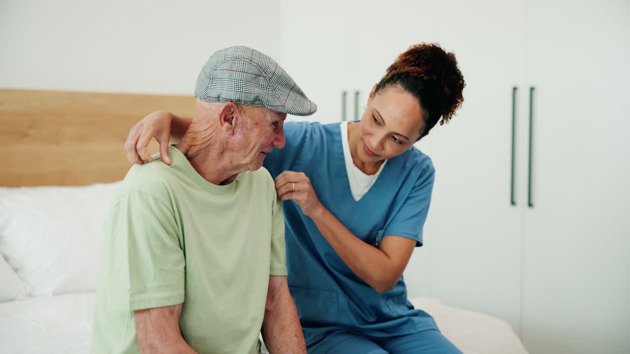 Nurse assisting elderly man at home