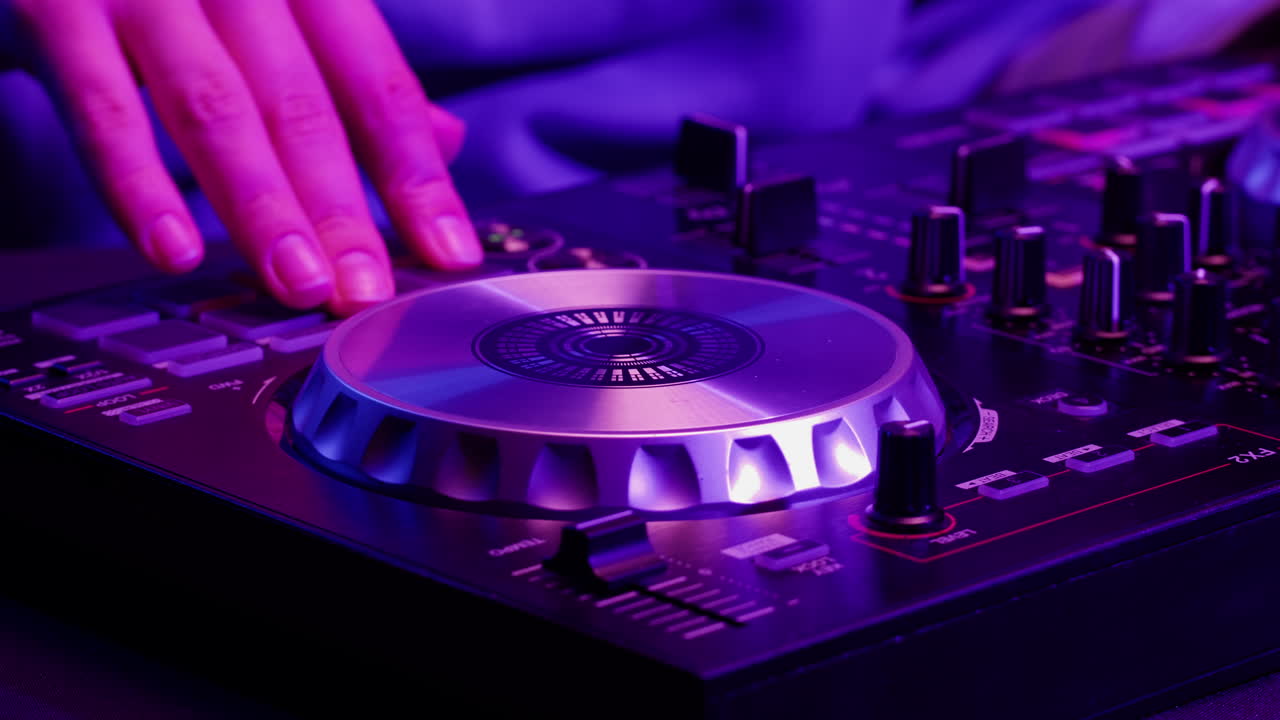 DJ with headphones and sunglasses playing music on festival in night club. Techno musician performing at nightclub for concert crowd of people, city bar.