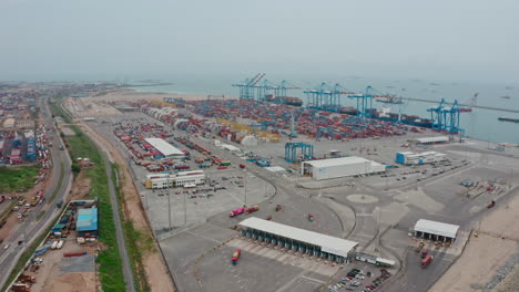 commercial shipping containers on the port's ground waiting to be shipped