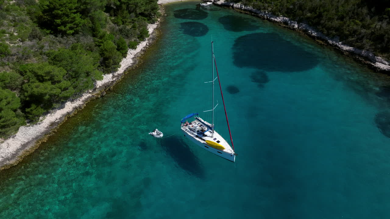 Sailboat In The Lagoon By Pakleni Islands In Adriatic Sea, Croatia. - aerial shot