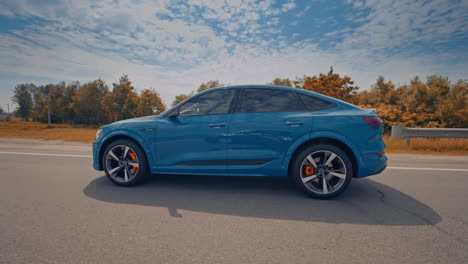 audi e-tron sportback luxurious car. side view of audi e-tron electric car on road