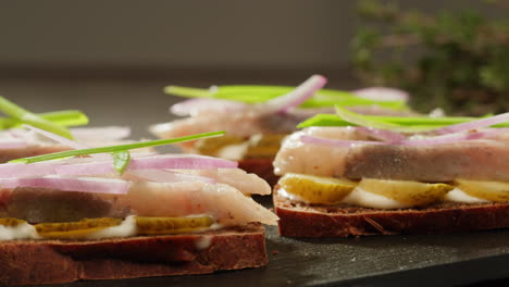 herring sandwiches with onions and pickles