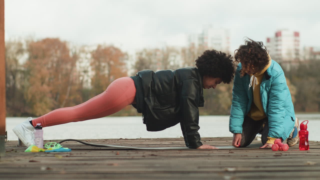 Girl doing a plank outdoor