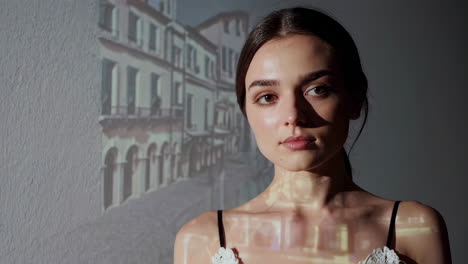 portrait of a young woman with projected cityscape