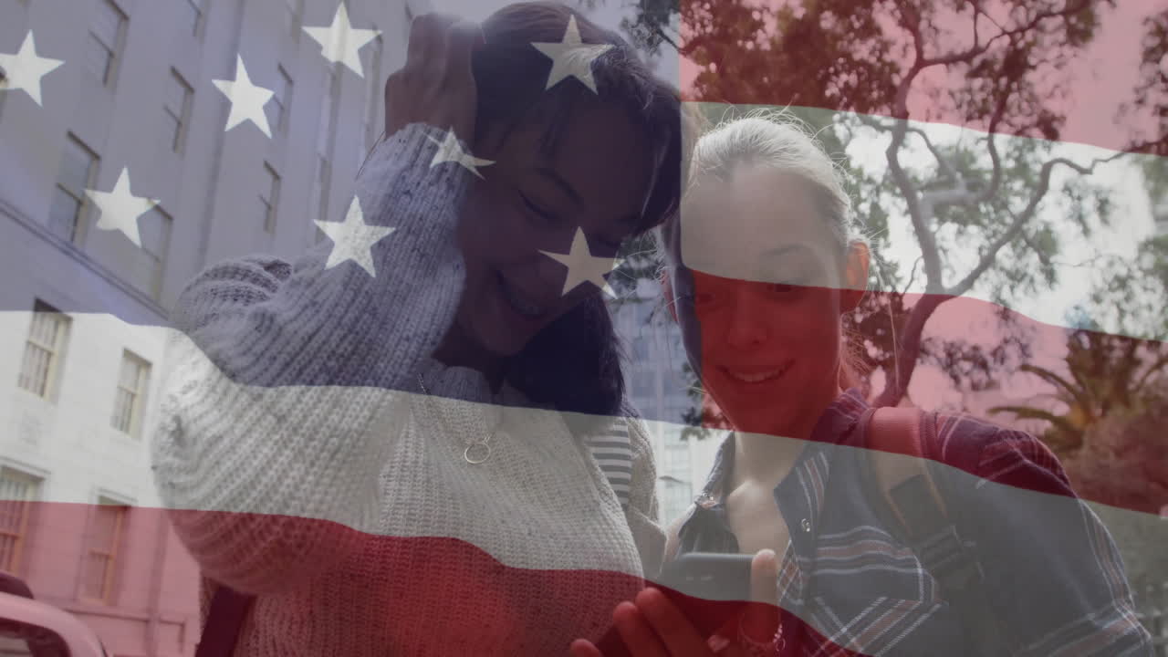 Smiling at phone, two people outdoors with American flag animation overlay