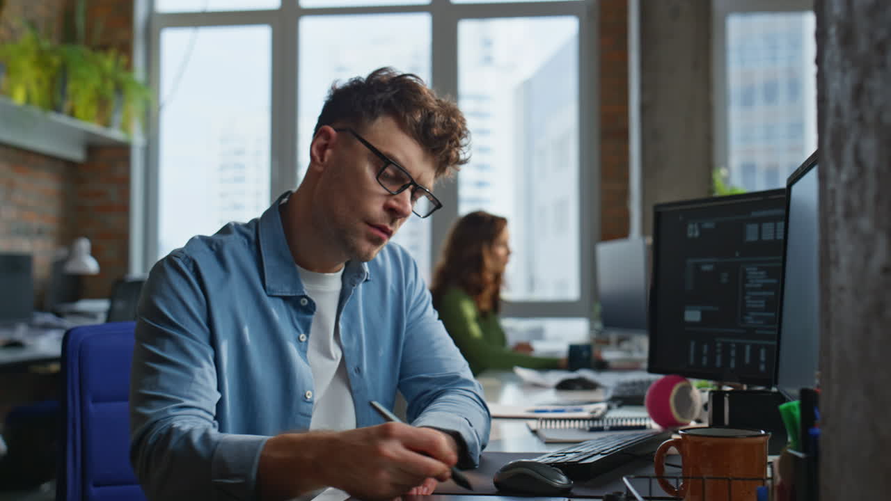 Serious businessman looking computer at office closeup. Focused man working pc