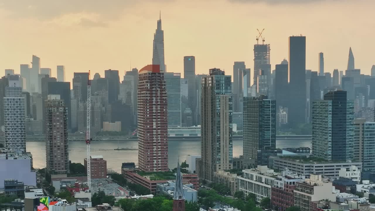 Drone view of New York City skyline showcasing urban architecture and water