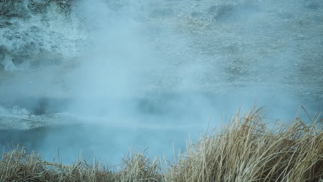 hot steam coming up from hot spring, travel destination, hot creek geological site, low angle