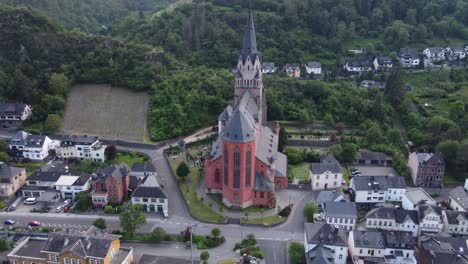 towering romantic red church of our lady in oberwesel medieval town, germany