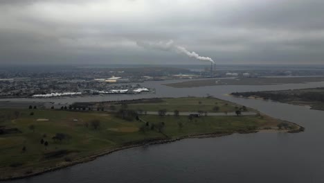 A-high-angle-time-lapse-over-a-water-marsh-on-a-cloudy-day