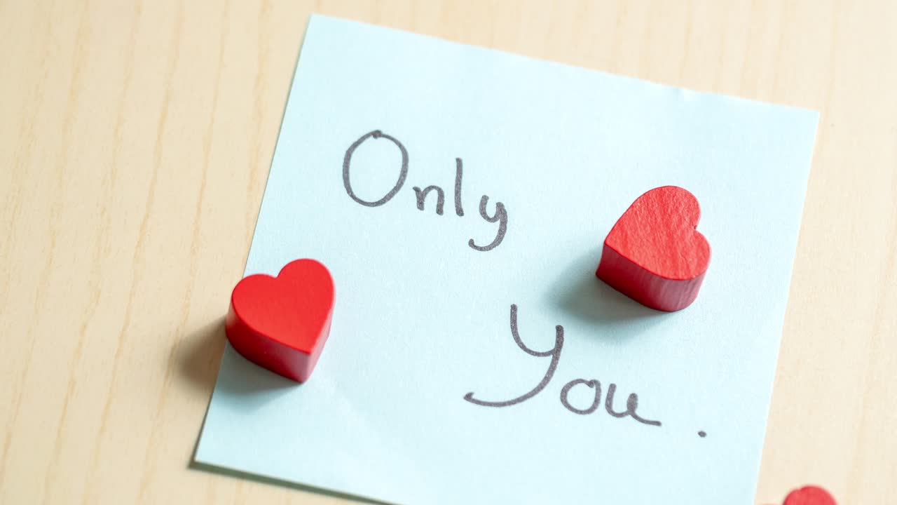 A sweet message of love captured with heart tokens in a cozy home environment.