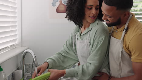 Black-couple,-bonding-and-cleaning-vegetables