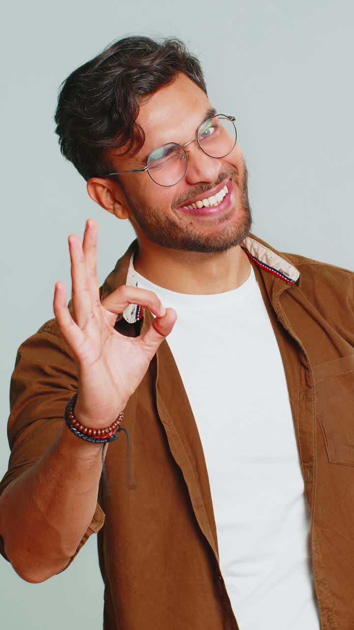 Happy indian man showing ok gesture like sign positive feedback celebrate victory approve idea