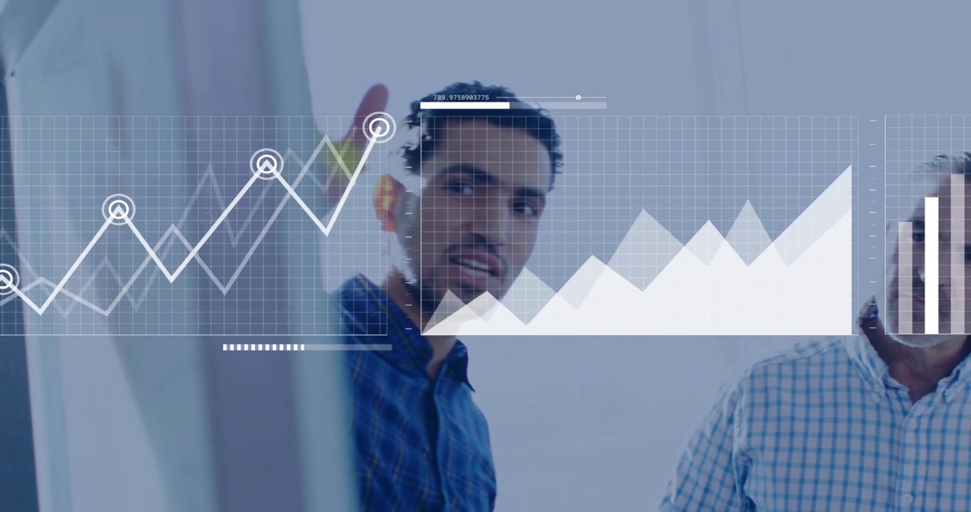 Business analyst pointing at glass and activating animated charts, team noting trends for planning