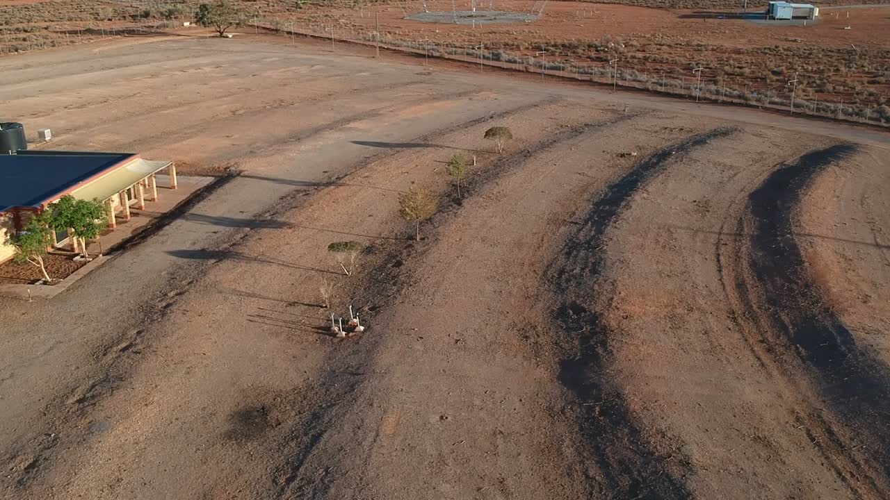 Drone flight over old abandoned drive in theatre