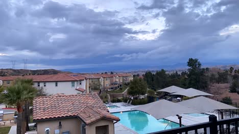 view over residential swimming pool and surrounding neighborhood on cloudy day