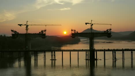 Bridge Construction Under Sunset