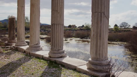 sun shining through pillars of the ionic stoa in the hellenistic gymnasium in miletus