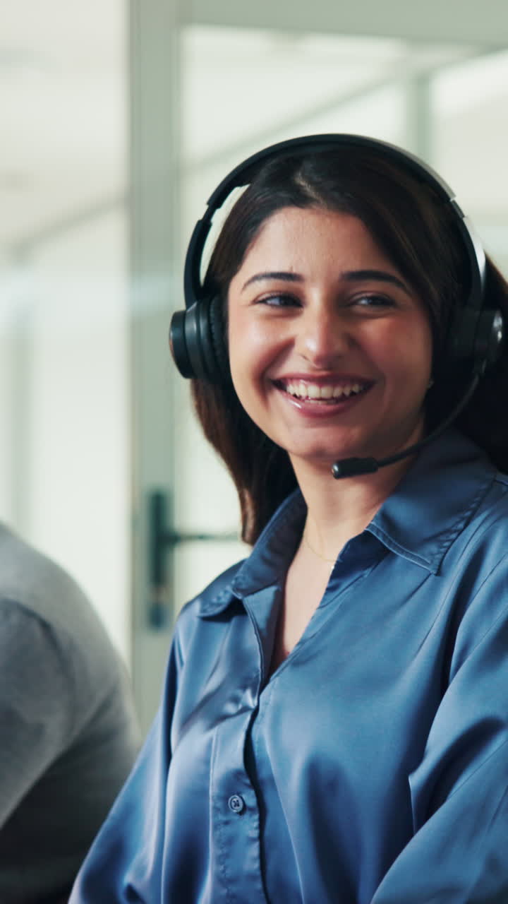 Smiling Professional Woman Wearing Headset in an Office