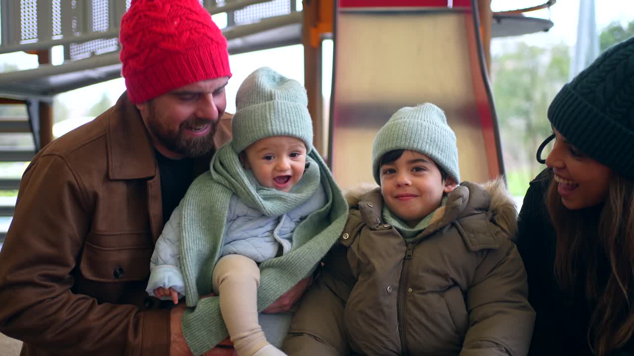 Family having fun at the playground