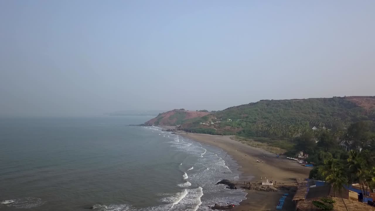 Drone shot flying towards the sun and landscape in Goa, India